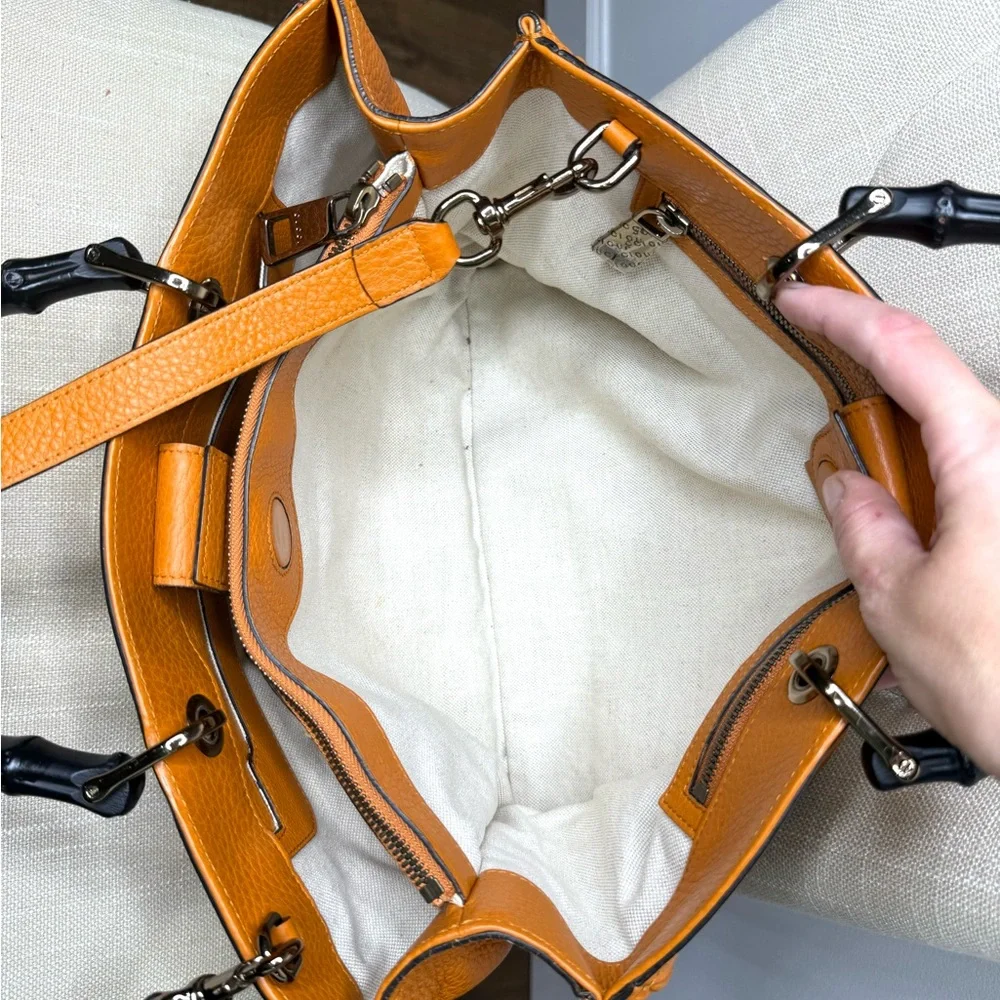 Gucci authentic satchel bag orange leather black bamboo handles with a strap